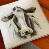 Platos decoupage para regalar León vaca frisona